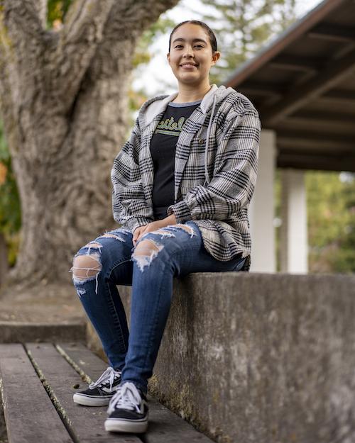 Angela Garcia seated on bench